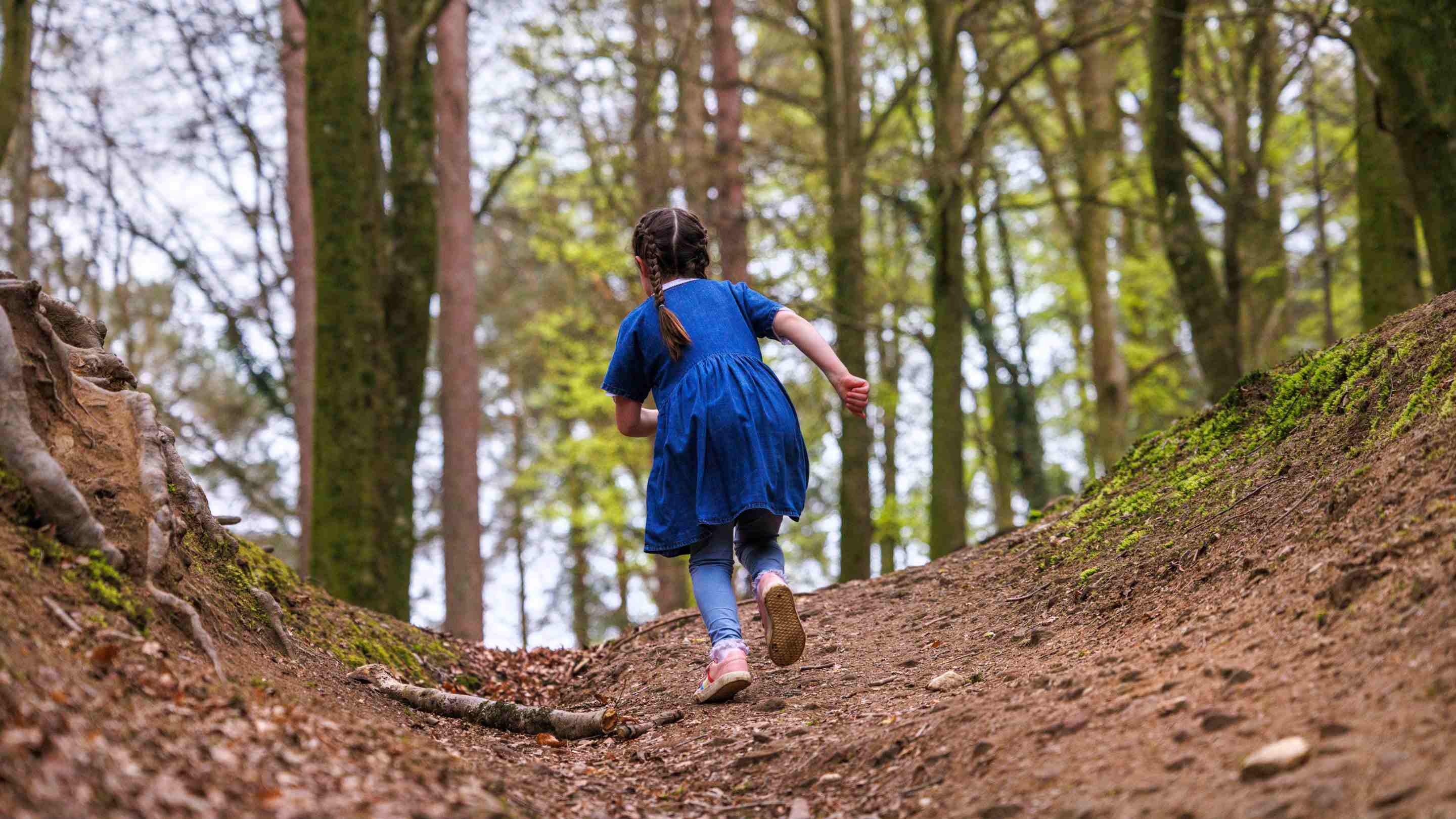 Girl running in wood